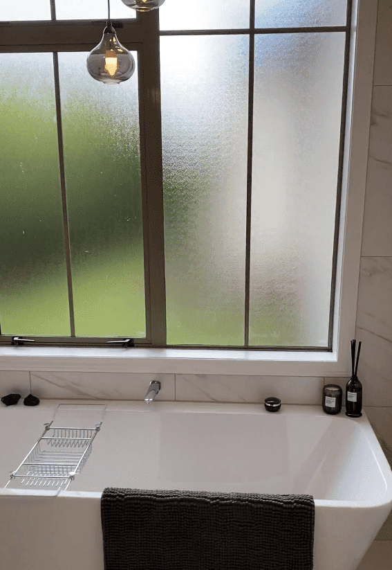 bathroom renovations st heliers-min Freestanding bath and marble-look porcelain tiles in a St Heliers bathroom