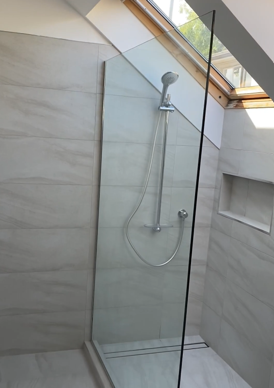 single panel shower 2 Walk-in ensuite shower under a skylight with frameless glass in Bayview