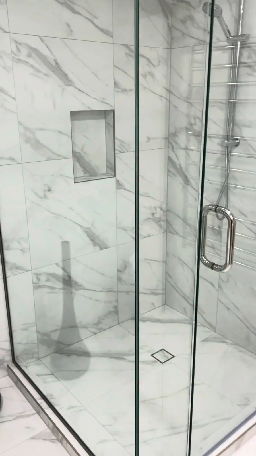 Tiled shower niche with metal trim and a square floor waste, Kohimarama shower