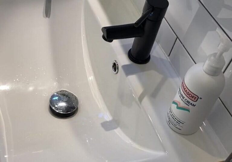 albany-bathroom-basin Matte black pin-lever mixer on a white ceramic basin top in a renovated Albany bathroom