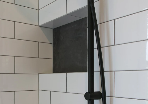bathroom renovations east auckland Recessed shower niche and matte black rail shower in an Epsom bathroom