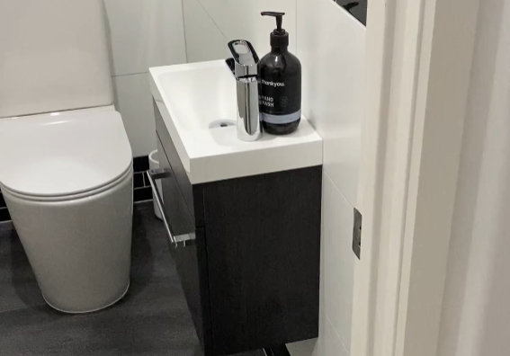 Second toilet room with a compact wall-hung vanity in Ponsonby