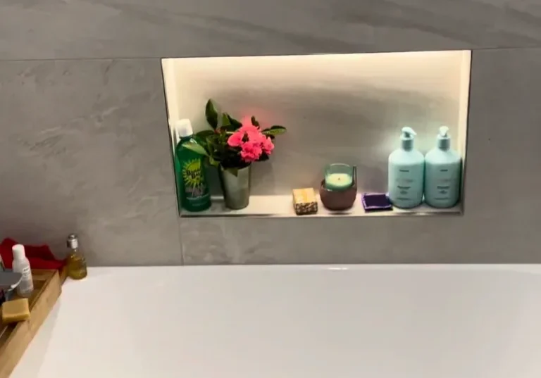 Glendowie Bath Lit Niche Built-in bath below a lit tiled niche with marble-look wall tiles in a Glendowie bathroom