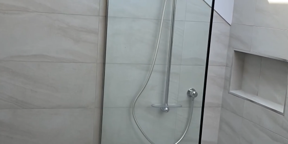 single panel shower 2 Walk-in ensuite shower under a skylight with frameless glass in Bayview
